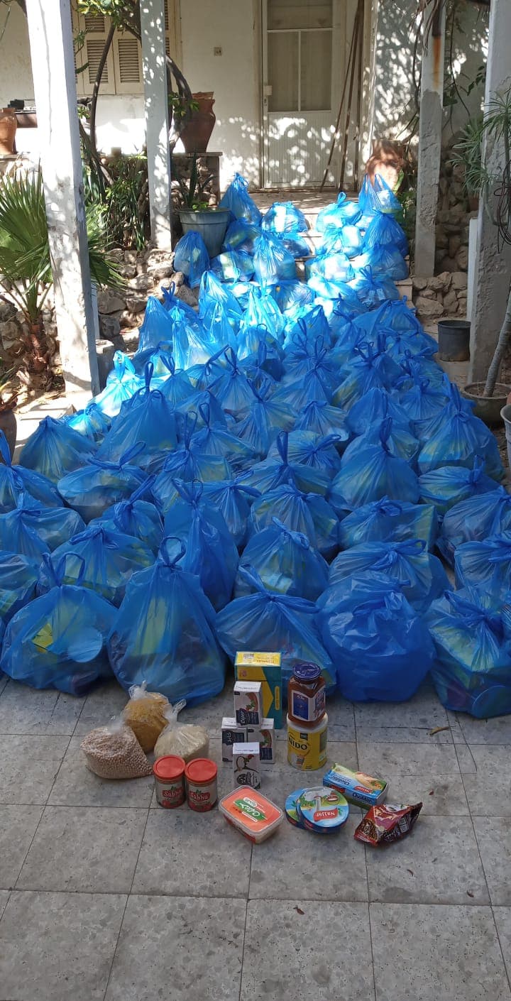Parcels stacked in a courtyard before going out to families